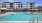 a swimming pool in front of a building