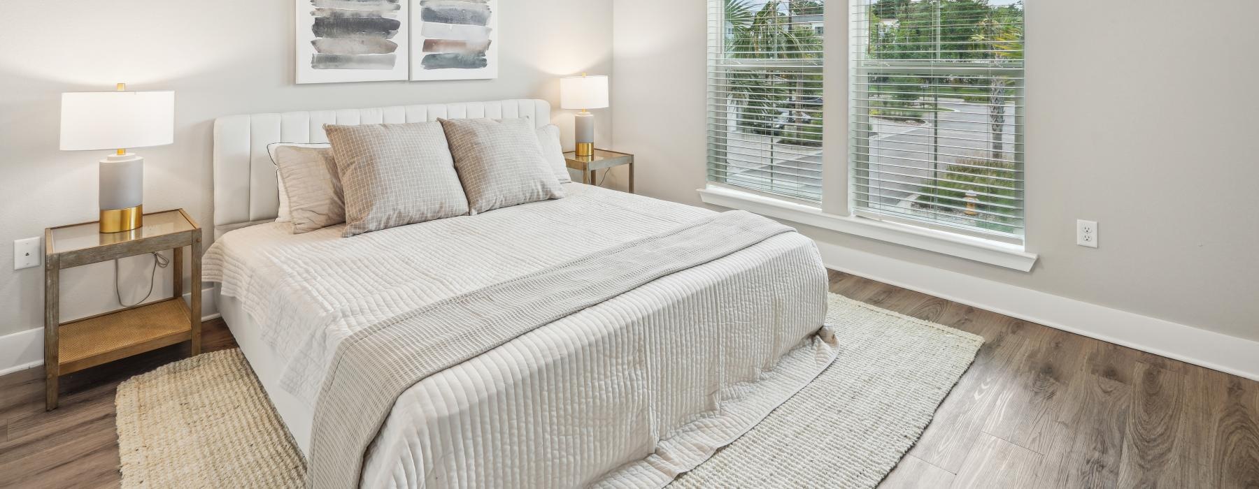 spacious bedroom with large windows