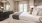 a bedroom with a large mirror