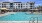 a swimming pool in front of a building